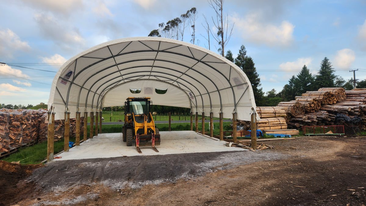 8m x 40ft shelter on posts covering firewood storage in Northland