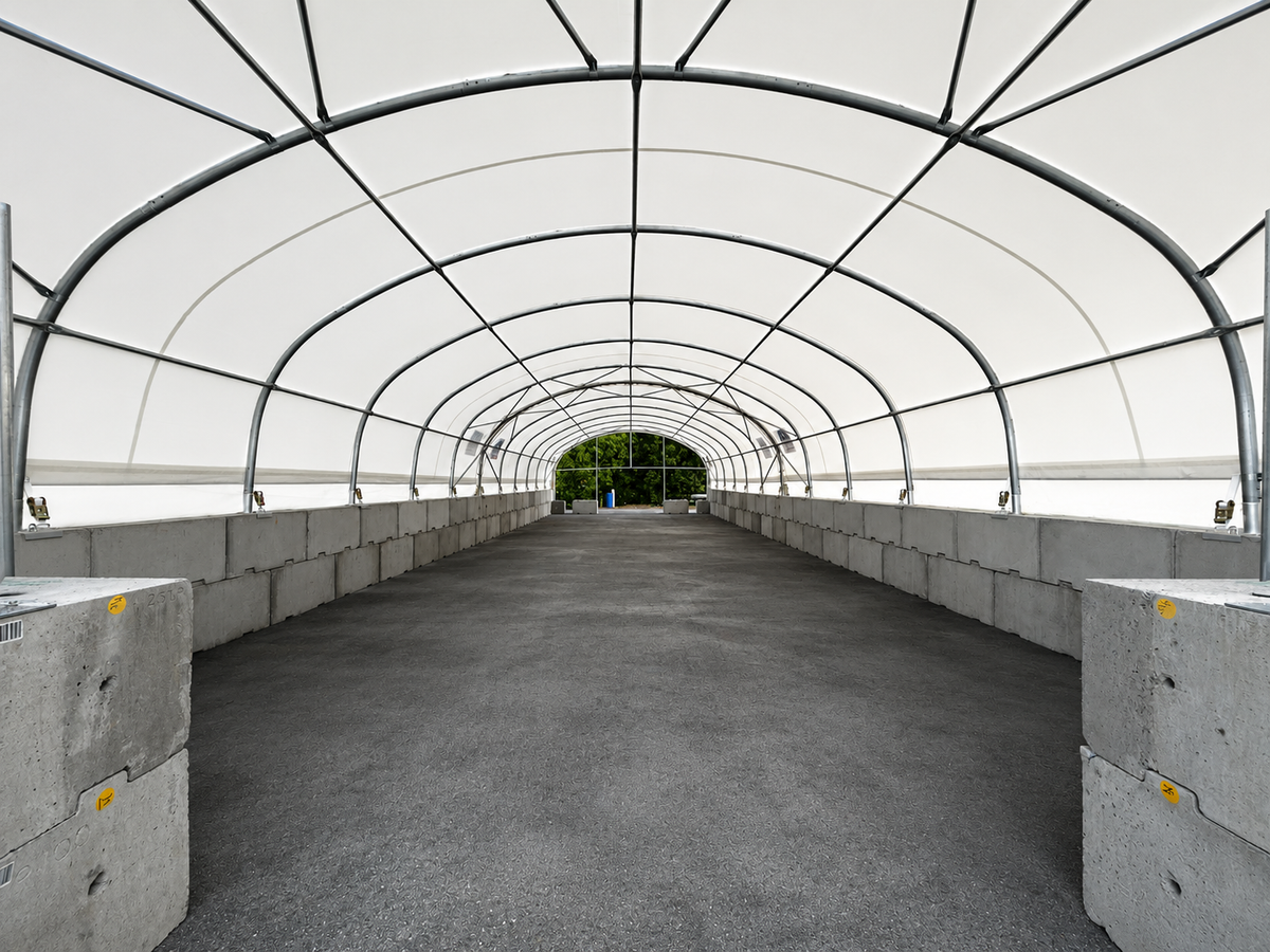 Two 8m container shelters on block walls covering a waka at Ngāti Whātua Ōrākei