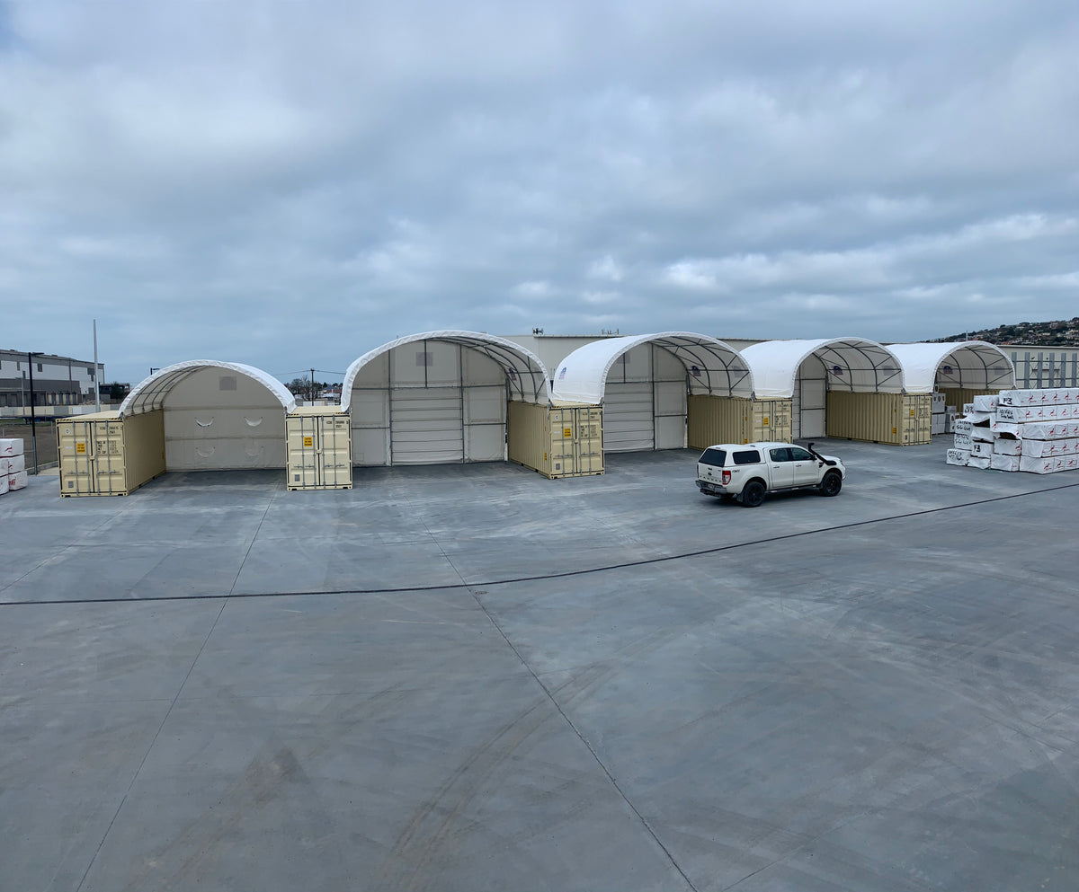 6m and 8m x 20ft shelters sharing containers at a Wellington Mitre 10