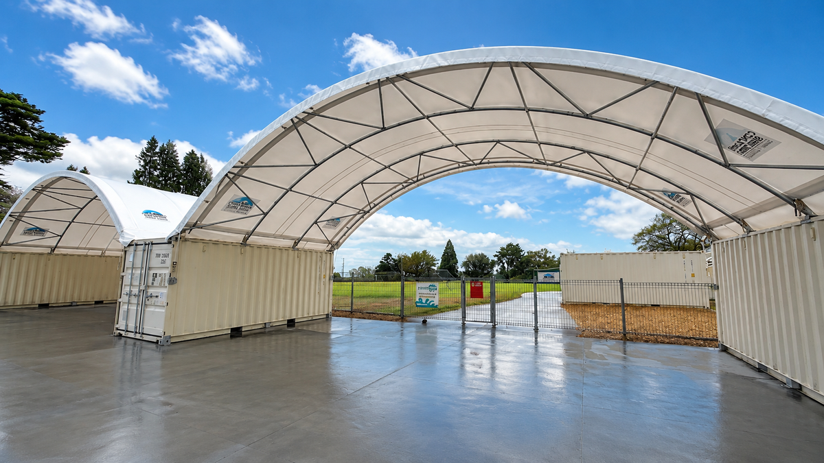 Twin 12m x 20ft HardLid shelters used as a bus stop at Tauriko School