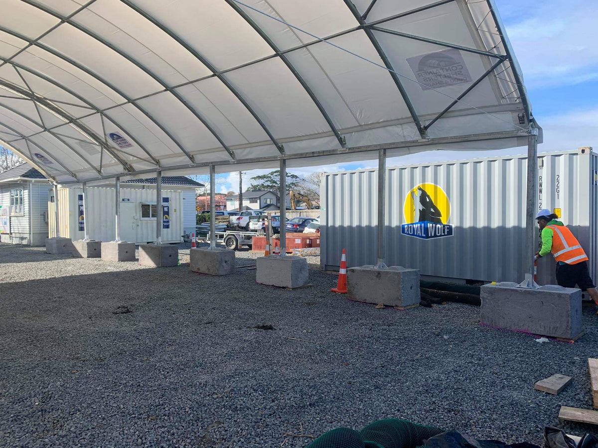 Container shelter on posts mounted to concrete blocks at an Auckland construction site